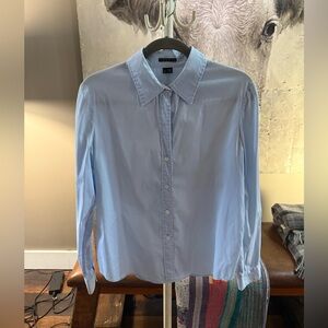 Women’s light blue button-down blouse by Theory